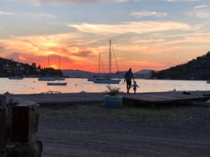 Granddad with his grandson on Plaka beach
